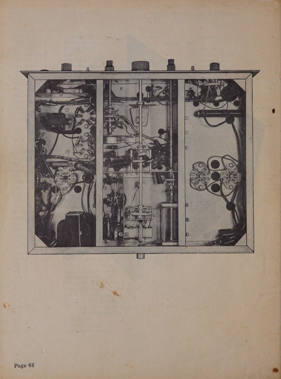 Figure 6 — The underside, divided into compartments by the sectional frame. The partitions are structural and electrical at once: they stiffen a chassis carrying 60 pounds of iron, and they keep the power, au…