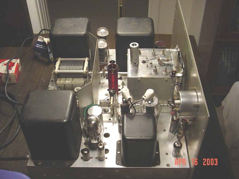 Figure 7 — A DX-100B chassis stripped and standing on the bench, the point in a restoration at which the transformers, tank and sockets are all that remain of the original.