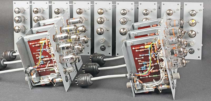 Figure 3 — Fifteen ES-201 operational amplifier modules after restoration, showing the phenolic PCBs, tube sockets, and sheet-metal housings