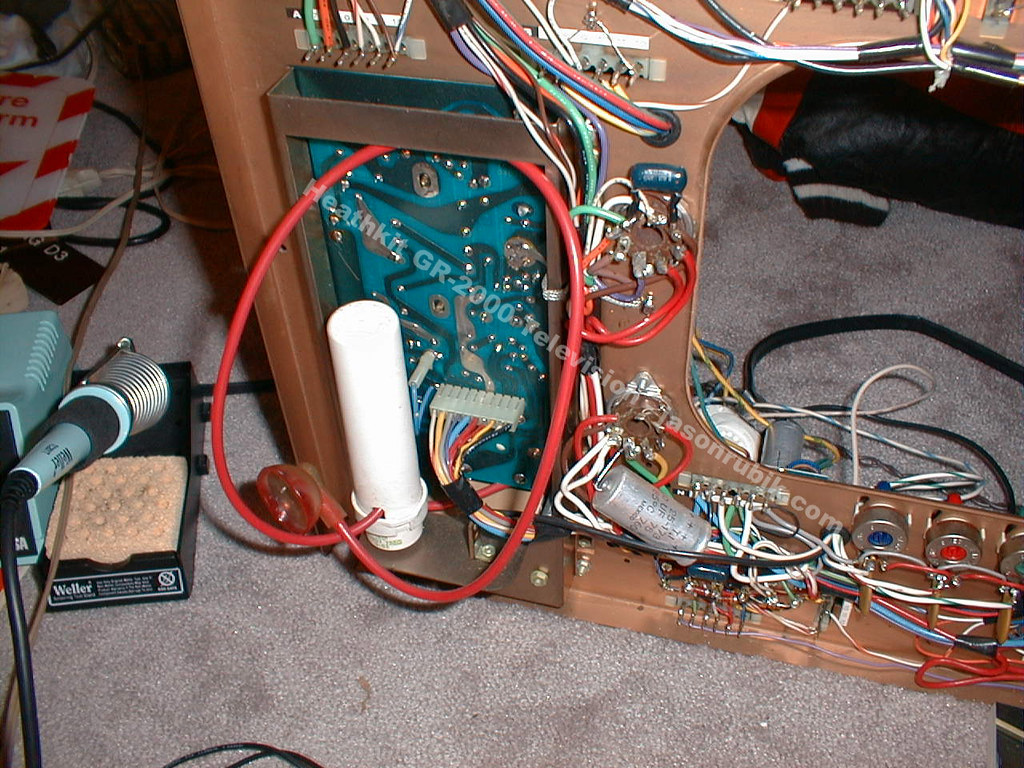 Figure 5 — A GR-2000 chassis open on the floor with a soldering station alongside. A build of this size occupies a room for weeks rather than an evening.