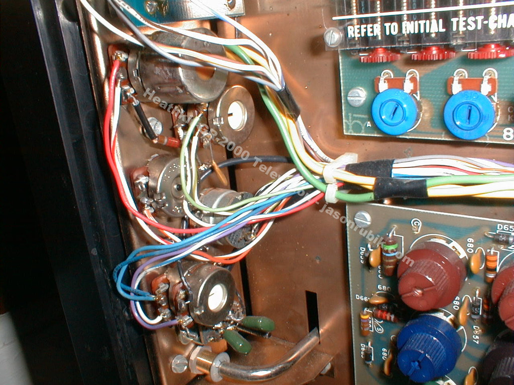 Figure 7 — The convergence area of a built set: the convergence board with its adjustable coils and controls, alongside the tube neck assemblies. The instruction "REFER TO INITIAL TEST-CHART" is printed on th…