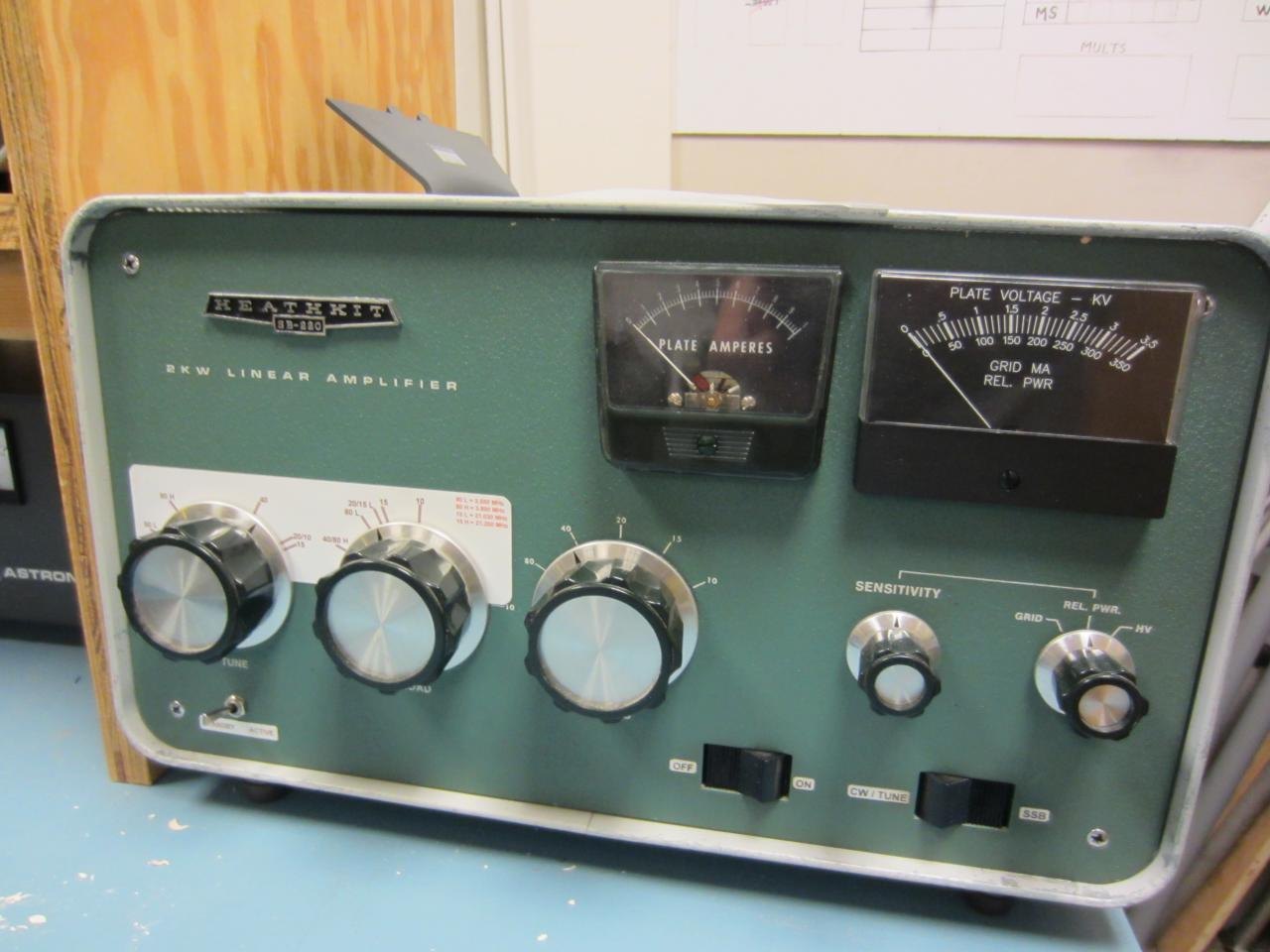 Figure 12 — An SB-220 in use. The two meters read plate current and a switchable grid current, relative power or high voltage; the three large knobs are band, tune and load.