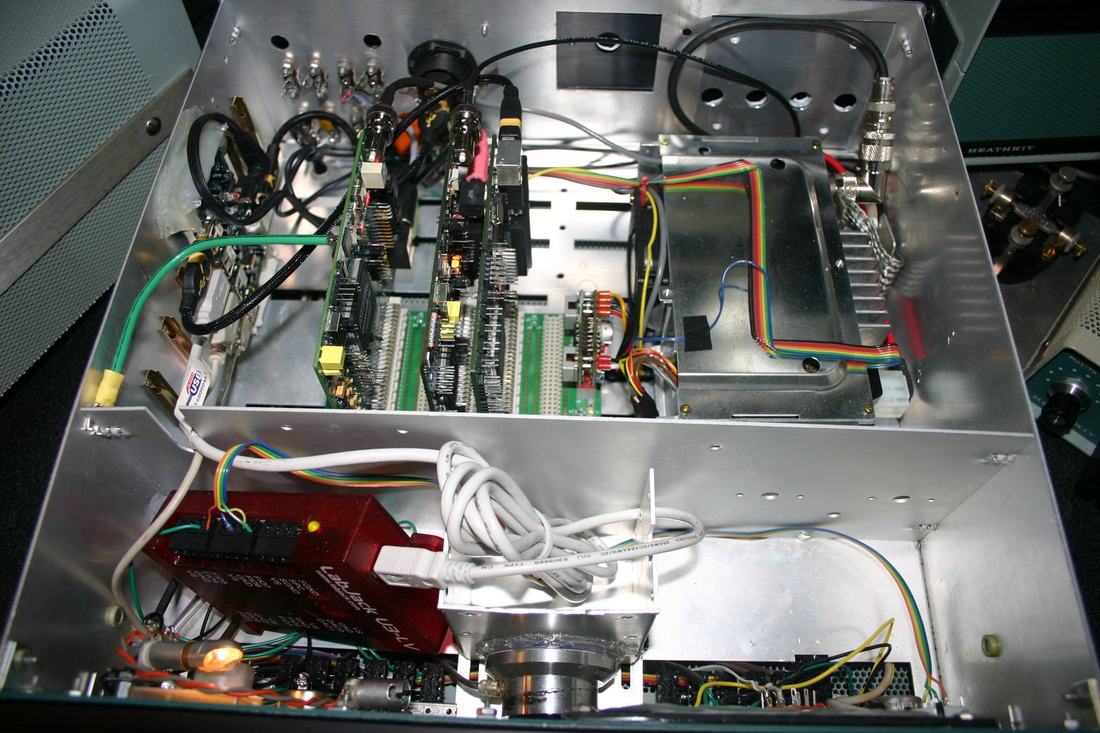 Figure 2 — A second life: an SB-104 chassis gutted and refitted by Dan Quigley, N7HQ, with the Ozy, Penny and Mercury boards of the open-source HPSDR software-defined radio, photographed in 2009. The Heath ca…