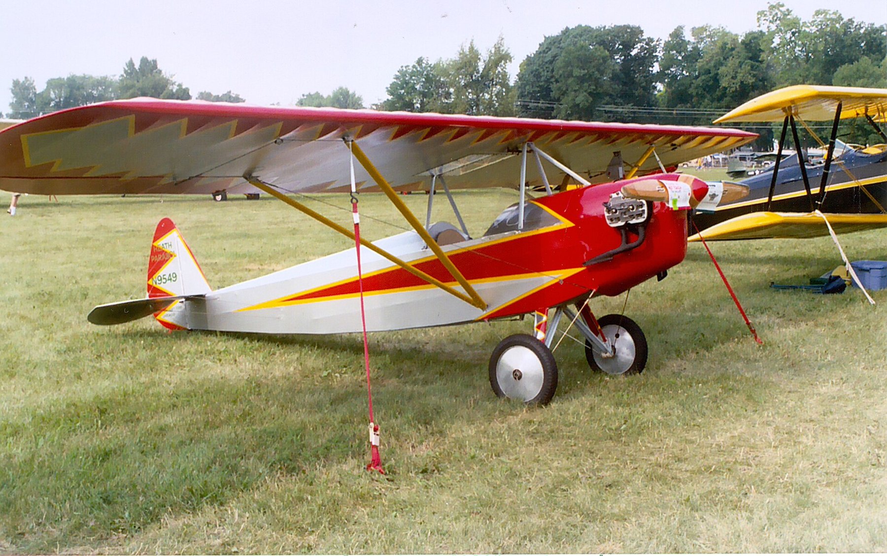 Figure 10 — A V Parasol at the EAA AirVenture fly-in at Oshkosh, Wisconsin, in 2003. The V-shaped wing struts gave the 1930 model its name; home-built examples were modified freely, most often with split-axle …