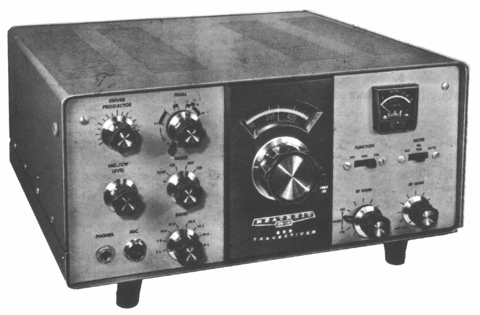 Figure 2 — The publicity photograph that opens the assembly manual. Left to right on the panel: DRIVER PRESELECTOR and FINAL tuning and loading above the MIC/CW level and RF and AF gain controls, the main tun…