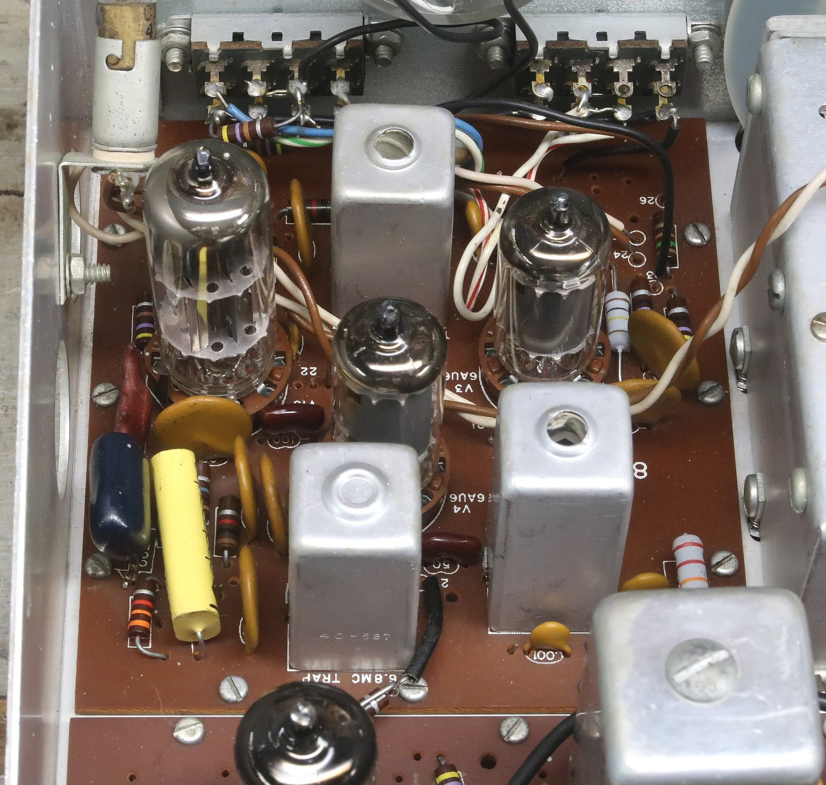 Figure 7 — The IF circuit board, carrying V3 and V4, transformers T102 and T103 and the 6.8 MHz trap. Parts on this board are numbered in the 100–199 range.