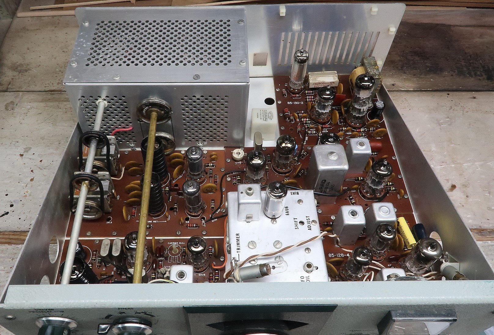 Figure 15 — The interior after cleaning. Cleaning a chassis is not cosmetic vanity: dirt on a coil former or a switch wafer is a leakage path, and dirt on relay contacts is the chirping fault Heath documented.