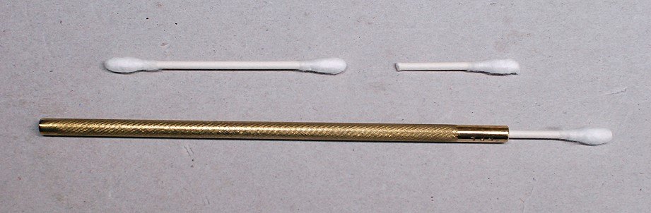 Figure 12 — A cotton bud cut in half and fitted into a drilled brass rod. Chassis cleaning between coil cans, relays and IF transformers is mostly a matter of reach.