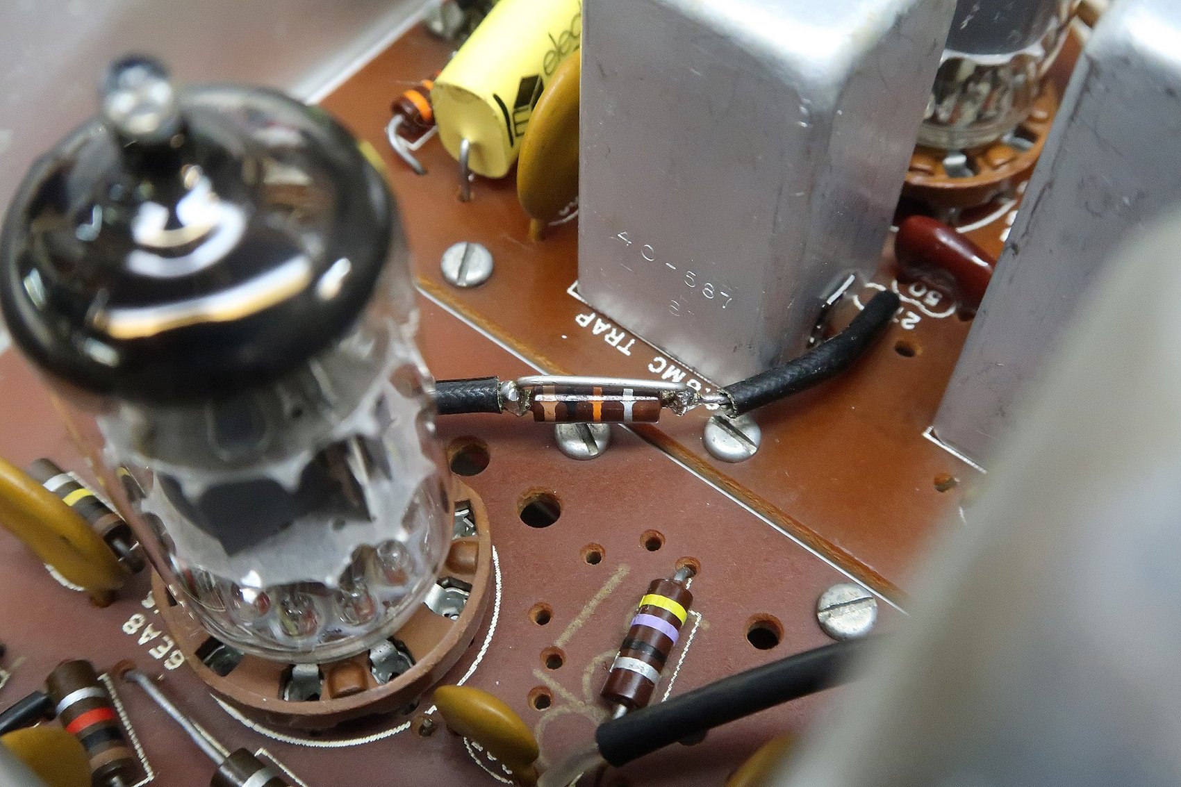 Figure 10 — R202 shunted with a wire rather than removed — electrically the later configuration, physically still the early one, and legible as such to the next owner.