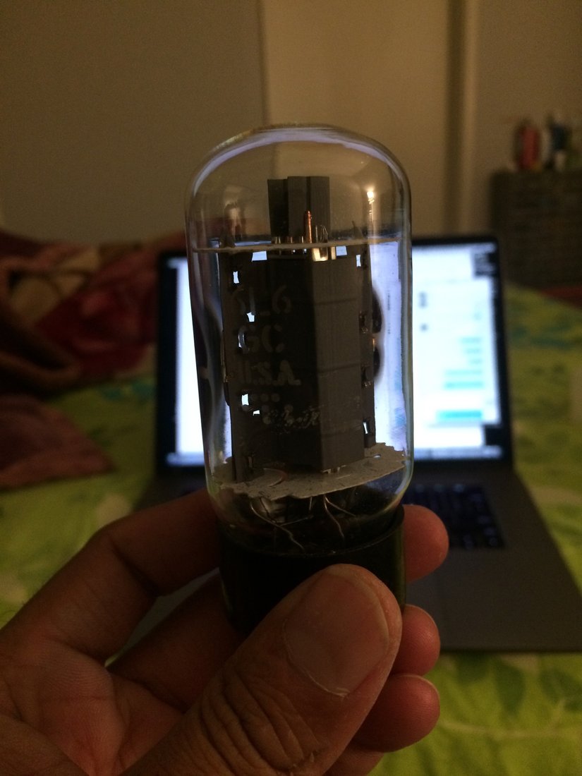 Figure 3 — A 6L6GC beam-power tube — the series-pass device — held up, lit. Photo: lazyelectrons.wordpress.com.
