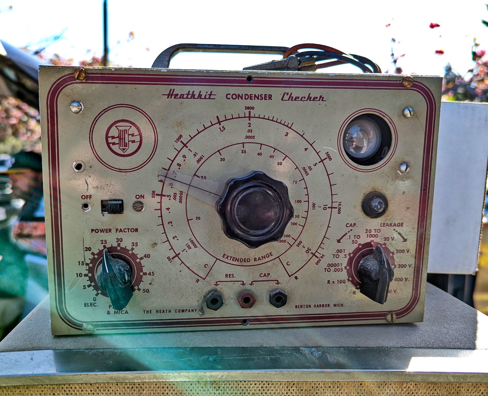Figure 2 — A Heathkit Condenser Checker of the C-series, its maroon-on-cream panel worn by decades of use, at the Silicon Valley Electronics Flea Market in 2022. Its extended-range scale and 0.00001 µF lowest…